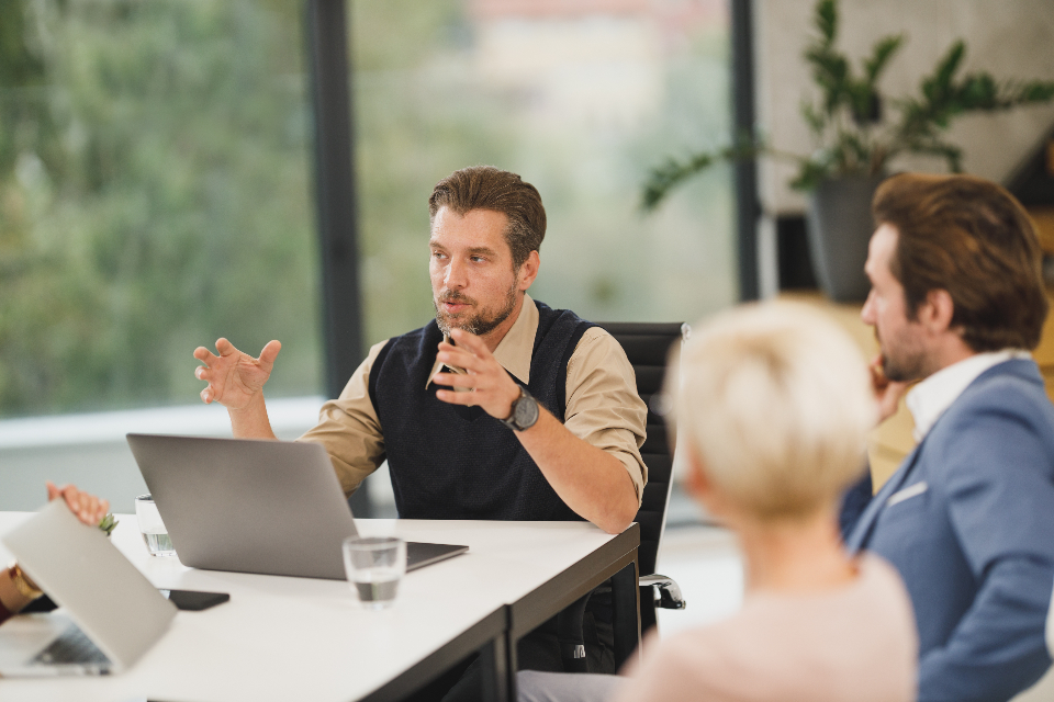 A small team talking through a problem around a table
